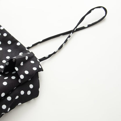 Women's sleeveless polka dot suspender dress