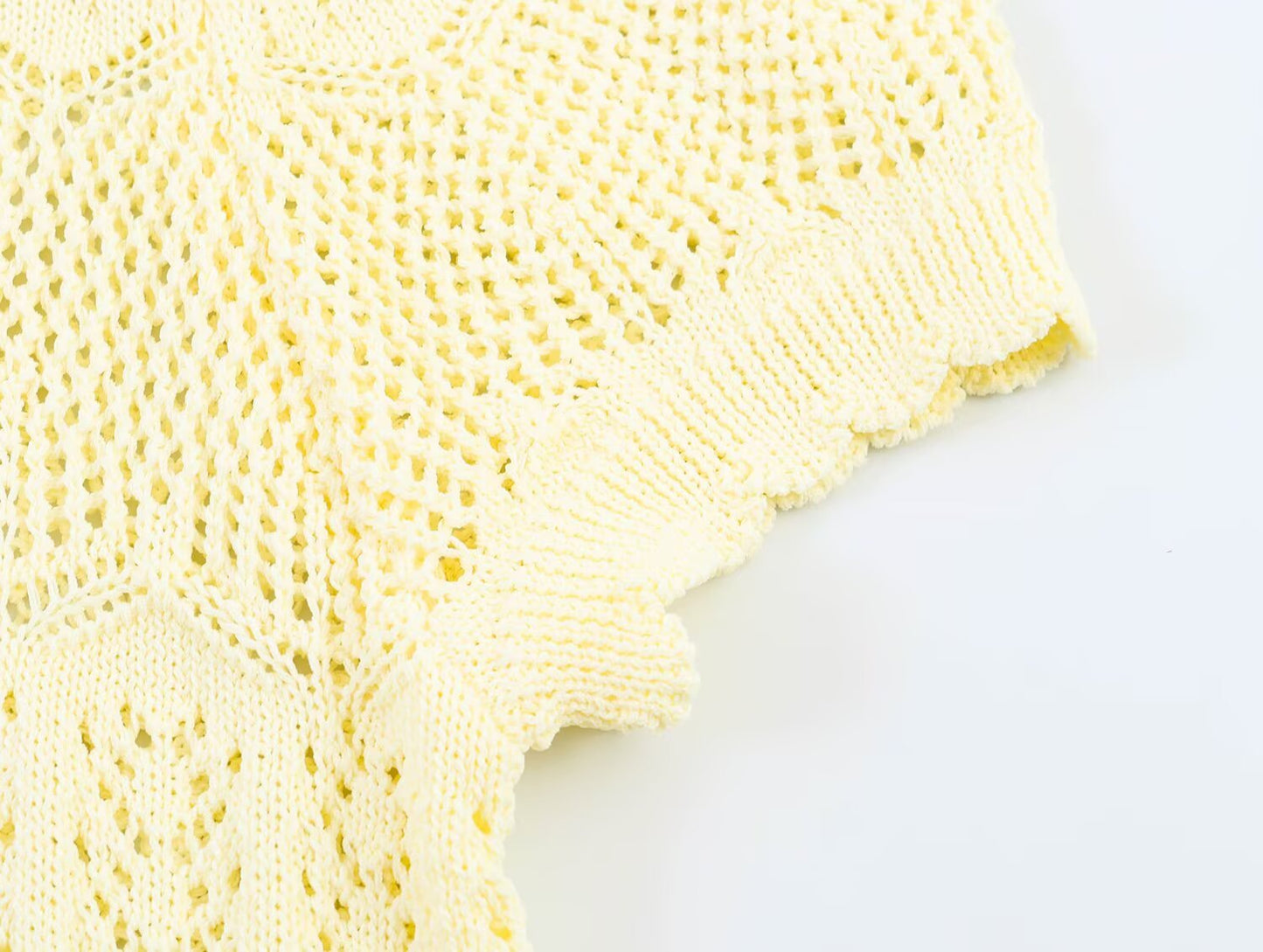 Women's short sleeved hollow knitted cardigan
